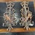 A pair of Mid 20th century hand carved wood sconces with bronze bobeches. These lovely large panel sconces are hand carved...