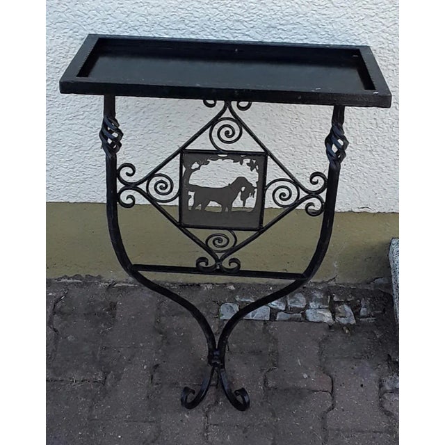 German vintage garden console, wrought iron plant table, handmade with brass shadow crack, a hunting scene, hunting dog...