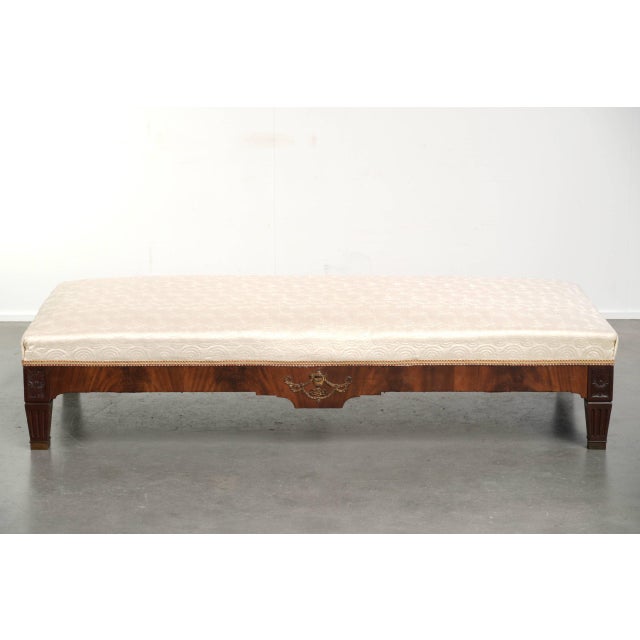 This beautiful antique French Empire-style bench/window seat features a silk seat with an elegant pattern and a wooden...