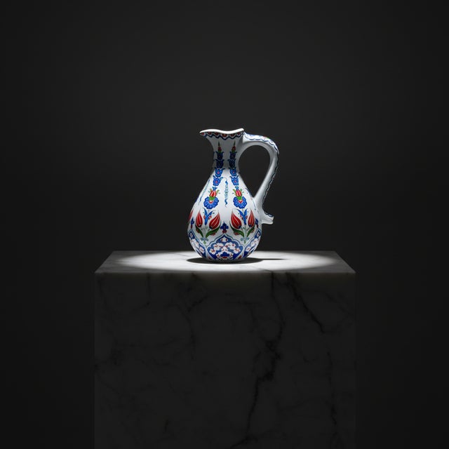 The Garden in Motion This Handmade Ceramic Pitcher is a study in vertical grace. Standing at 25 cm, its Slender Form is...