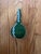 Stunning vibrant green gourd filled with seeds to create sound. Gorgeously beaded exterior. This is a lovely unique piece.