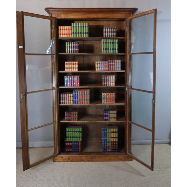 19th-century walnut bookcase beautiful bookcase from the first half of the 19th century in its original condition. This...