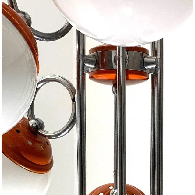 A very rare and much sought-after orange and chrome 70s 'Sputnik' pendant lamp. The manufacturer is unknown but possibly...