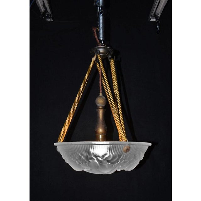 An elegant french art deco plafonnier ceiling light associated with the distinctive glassmaking tradition of the grandes...
