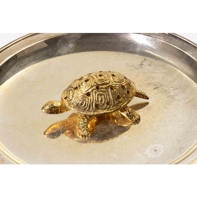 Charming silver-plated shallow dish featuring a sculptural gilt turtle at its center. The turtle is finely detailed with...