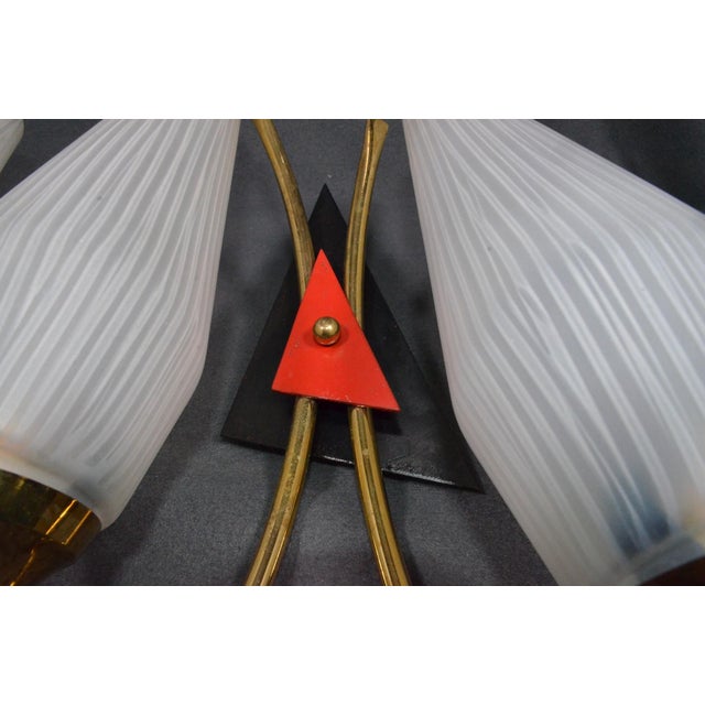 Elegant pair of French Mid-Century Modern double wall sconces dating from the 1950s–1960s, designed in the spirit of...