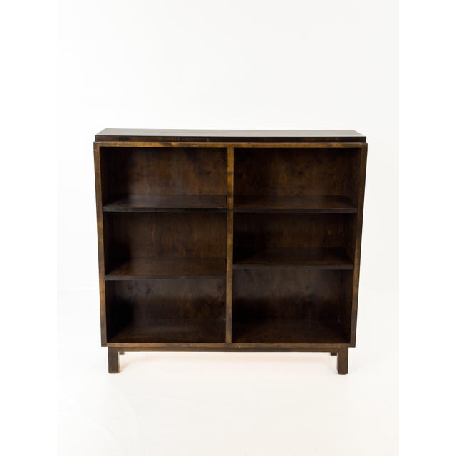 A refined Swedish Grace bookcase attributed to Axel Larsson, executed in richly figured stained flame birch, Sweden, circa...