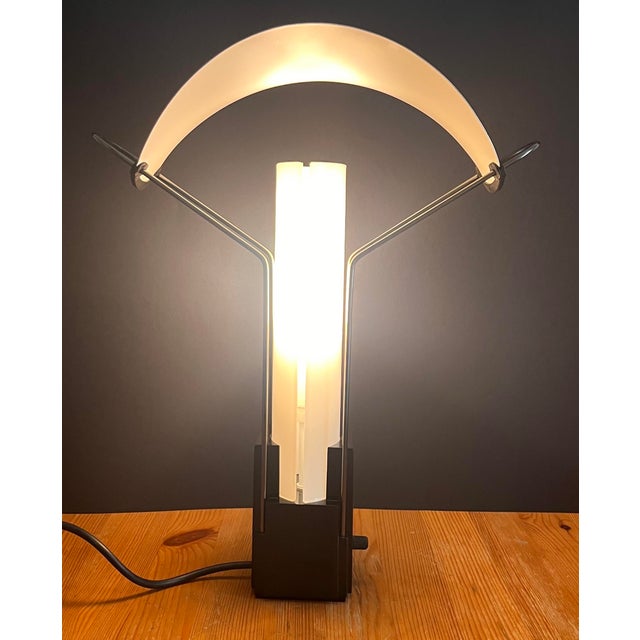 "Palio" table lamp by Perry King and Santiago Miranda designed for Arteluce, Italy 1980s The lamp has two opal glass...