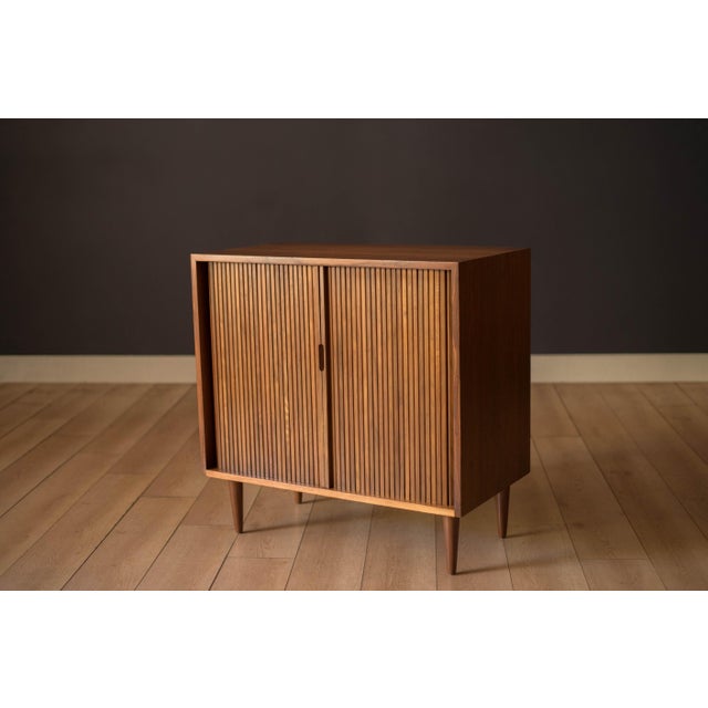 Mid century modern cabinet console chest in walnut designed by Milo Baughman for Glenn of California, circa 1950's. This...