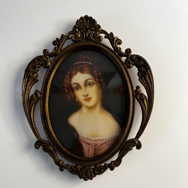 Charming miniature framed portrait of a young woman with red hair. Made in Italy as stamped on back of decorative metal...