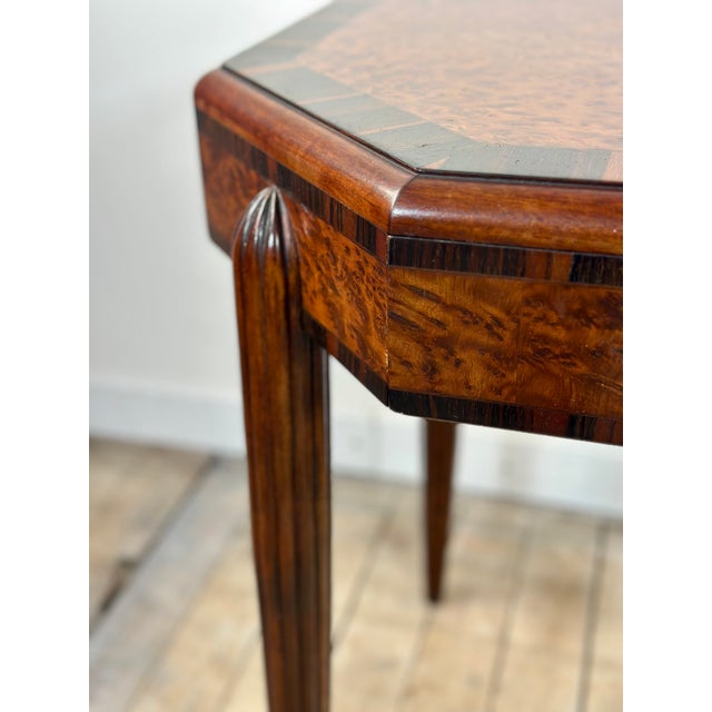 An elegant octagonal Art Deco side table, crafted in the 1920s in the style of Paul Follot. This refined piece features a...