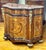 This exquisite French Louis XV-style bombe commode showcases an exceptional combination of richly figured wood, intricate...