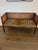 Vintage Hollywood Regency cane-back bench reupholstered in Ballard Designs’ iconic jaguar-print fabric. A chic statement...