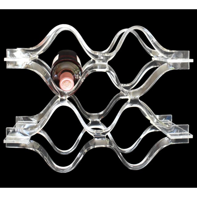 Fabulous twisted clear lucite 60s wine rack. Can be used either vertically or horizontally. Holds 6 bottles. In excellent...