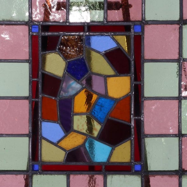This antique Arts & Crafts leaded stained glass window panel, dating to circa 1920, exemplifies the period's distinctive...