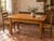 Authentic French farmhouse dining table crafted from solid oak, dating from the late 19th or early 20th century. The table...
