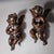 Pair of Baroque wall angels with wings, loincloths and curly hair. Their hands are folded in prayer. Carved wood with a...