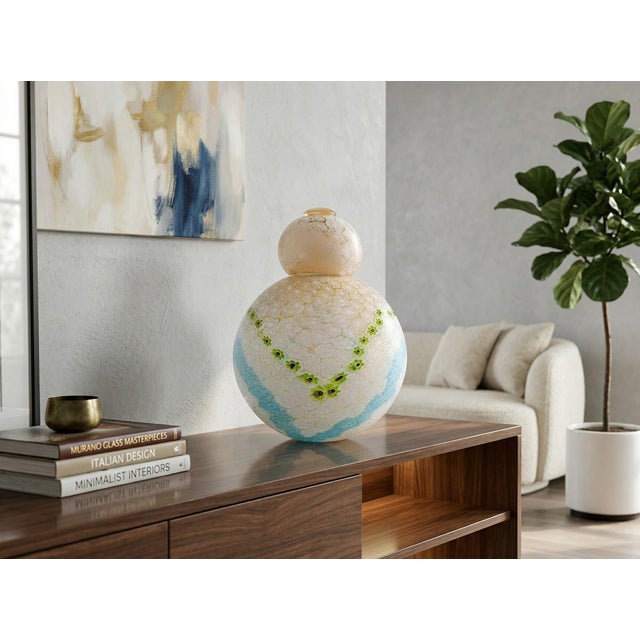 A refined Potiche in authentic Murano glass, entirely handmade. This vase is a triumph of glassmaking technique, where the...
