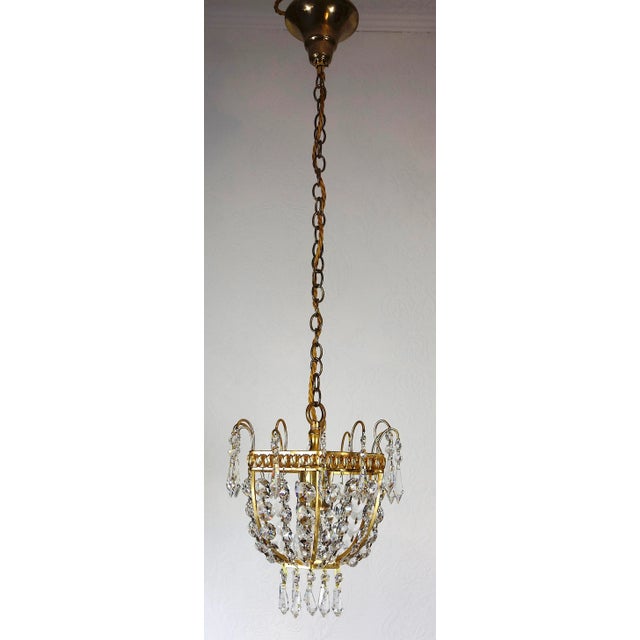Brass and Lead Crystal Chandelier from Palwa, 1960s, in Very Good conditions. Designed 1960 to 1969 This piece has an...