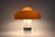 A plastic and metal lamp by Luigi Massoni, Brumbury model. Features a double switch to illuminate part or all of the lamp....