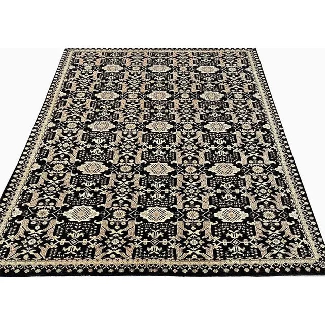 ACTUAL SIZE: 9’1″ x 11’9″ PRIMARY COLOR: Black / Beige AGE: New ORIGIN: Pakistan MATERIALS: Wool FOUNDATION: Cotton...