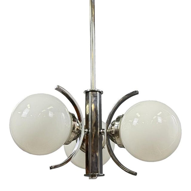1930s Art Deco chrome chandelier with three large opaline glass globes. Elegant curved arms, original chrome with natural...