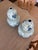 A striking pair of gourd-shaped vases, rendered in classic blue and white, features delicate Asian-inspired artwork that...