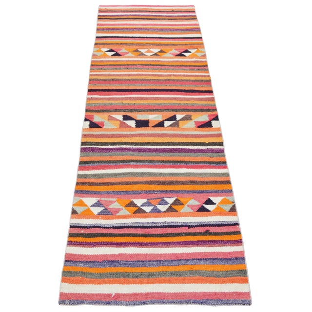 Hand-knotted with care using traditional rug-making techniques, this wool rug blends timeless craftsmanship with a modern...