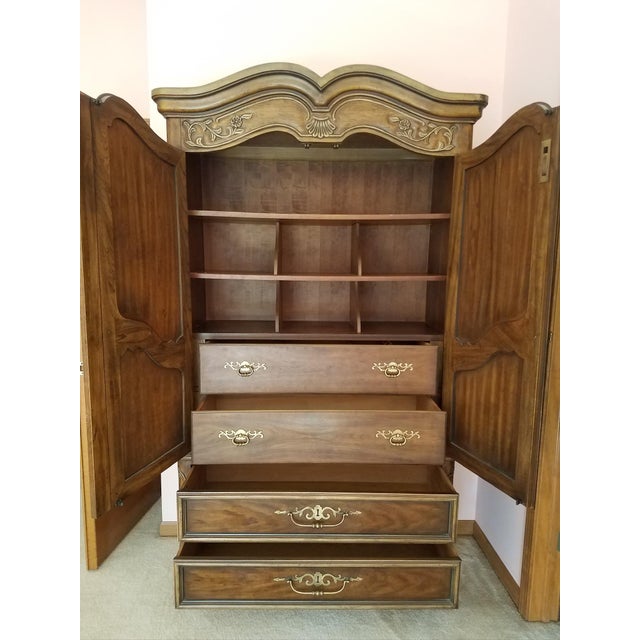 Elevate your bedroom or living space with this exquisite armoire from the coveted Brittany Collection by Drexel Heritage....