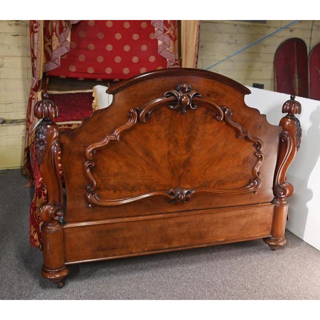 Impressive English Victorian half tester bed in richly figured mahogany The bed with a substantial carved headboard...