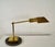 Vintage 1970's Mid century Modern desk lamp for sale. It's made of solid brass, and it has a round marble base. It has a...