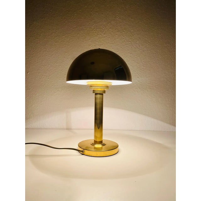 A beautiful mid-century table lamp made in Italy in the 1960s. It is fascinating with its beautiful shade. The table lamp...
