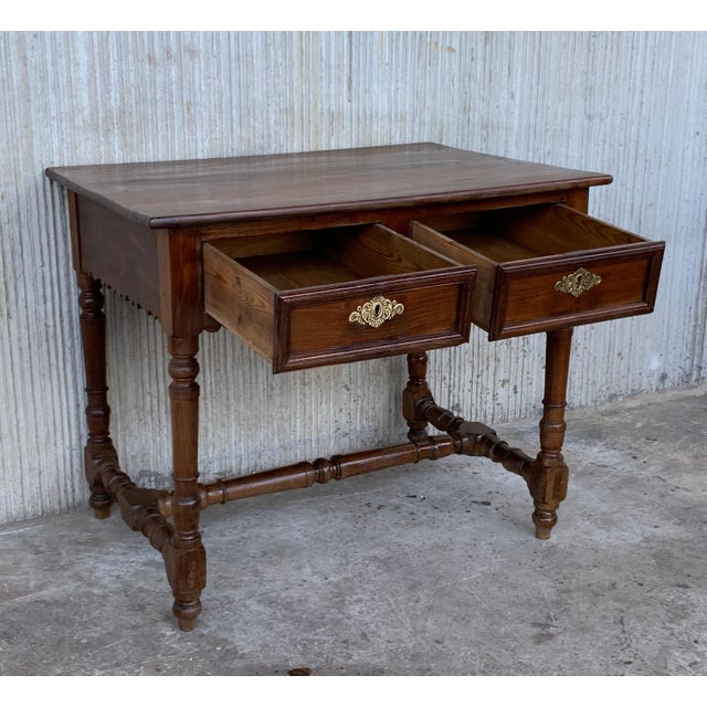 A charming early 20th century Spanish pine farm table with four tapered legs and a wonderfully well-worn finish from a...