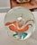 Add a splash of color with this vintage hand-blown glass paperweight with delicate orange pedals and teal leaves. Place on...