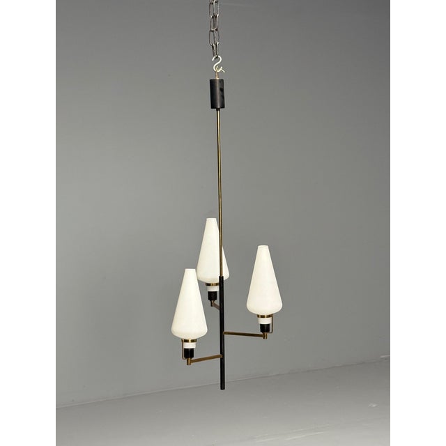 Italian Mid-Century Modern, Ceiling Pendant or Chandelier, Patinated Brass, Opaline Glass This captivating modernist...