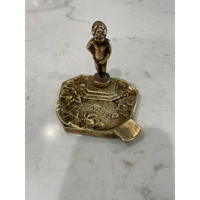 This Brass ashtray or trinket dish with little boy holding his penis would be adorable as decor in bathroom or guest room.