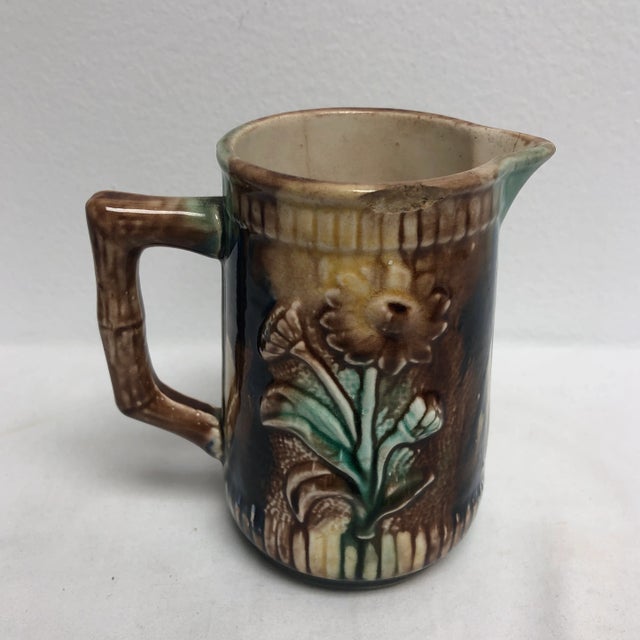 1920’s-1940’s English Majolica creamer with crane holding fish motif.