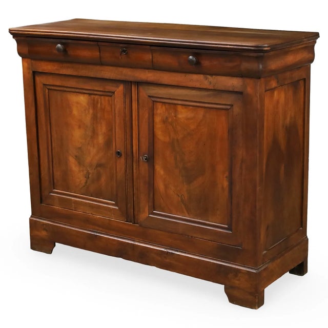 A handsome 19th-century French Louis Philippe buffet, crafted in walnut with beautifully figured panels and a warm, mellow...