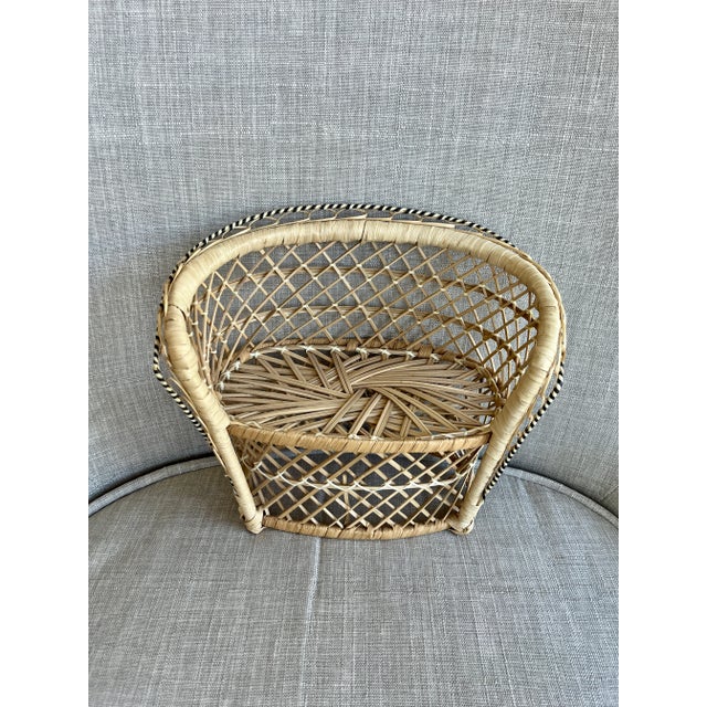 Charming and versatile, this vintage rattan loveseat brings bohemian warmth and natural texture to any space. Scaled...