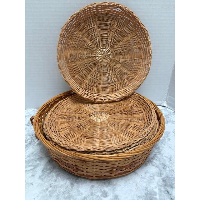 Vintage set of eight wood wicker plate holders for camping, picnics or barbecue celebrations. Comes with a basket to store...