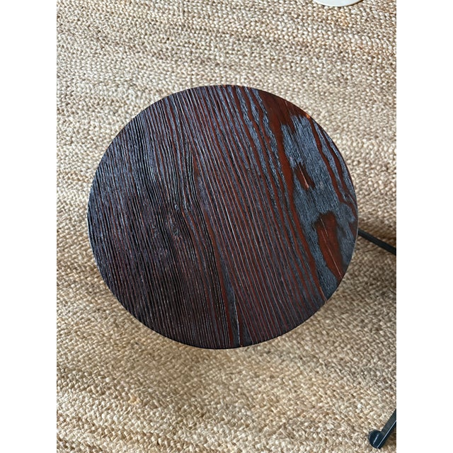 Very unique limited edition cast bronze and walnut topped side table signed Blackman Cruz. Part of the now discontinued...