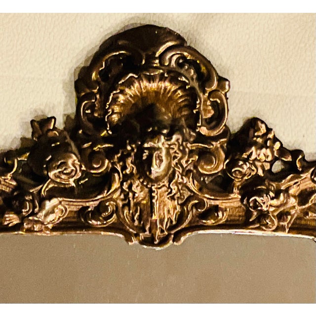 An exceptional late 19th-century American Victorian pierced brass wall mirror by the renowned maker Bradley & Hubbard,...