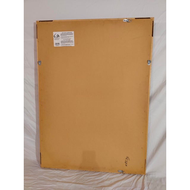 A beautifully ornate framed mirror made by Carolina Mirror Company's "Crown Fine Arts" Division. Features beveled glass,...