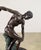Finely cast bronze sculpture inspired by the classical athletic form of ancient Greece, depicting a male figure in a...
