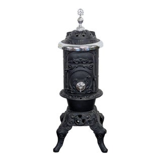 Antique Iron Parlor Stove With Decorative Silver Accents For Sale