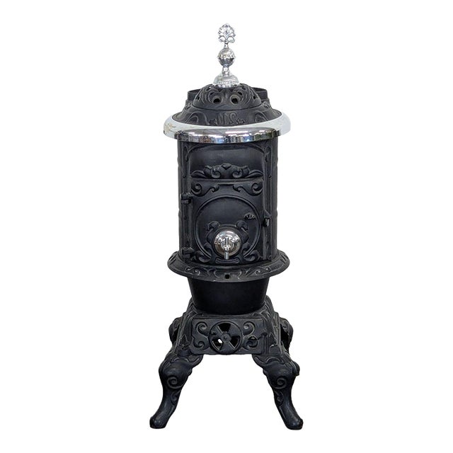 Antique Iron Parlor Stove With Decorative Silver Accents For Sale