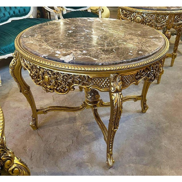 In love with the design. This round table is made with wood and the legs ahas details in gold leaf. You will definitely...