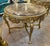 In love with the design. This round table is made with wood and the legs ahas details in gold leaf. You will definitely...