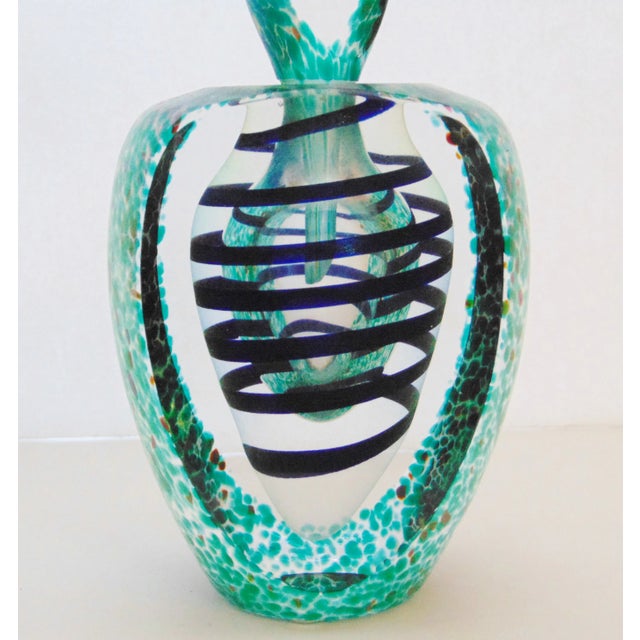 Art Glass Perfume Bottle , clear glass with green spots , green swirl design inside , illegible signature on base