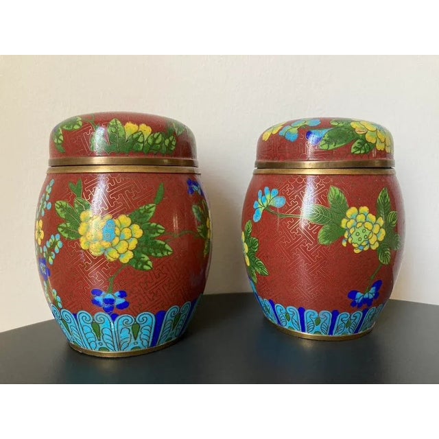 A beautiful pair of colorful cloisonne ginger jars, circa mid 20th century, China. Made of cloisonne enamel on brass,...